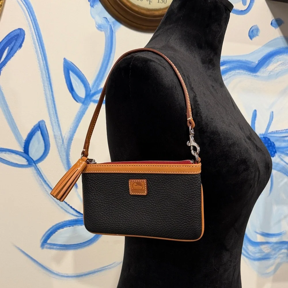 Dooney & Bourke Black and Tan Pebbled Leather Wristlet with Tassel - Picture 1 of 5